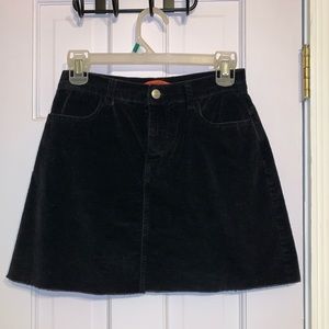 Small black corduroy mini skirt